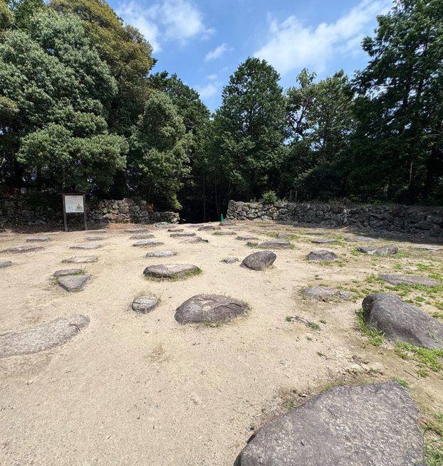 Foundation stones of the Azuchi tenshu in a sunlit clearing