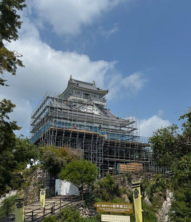 Gifu Castle keep on Mount Kinka wrapped in scaffolding